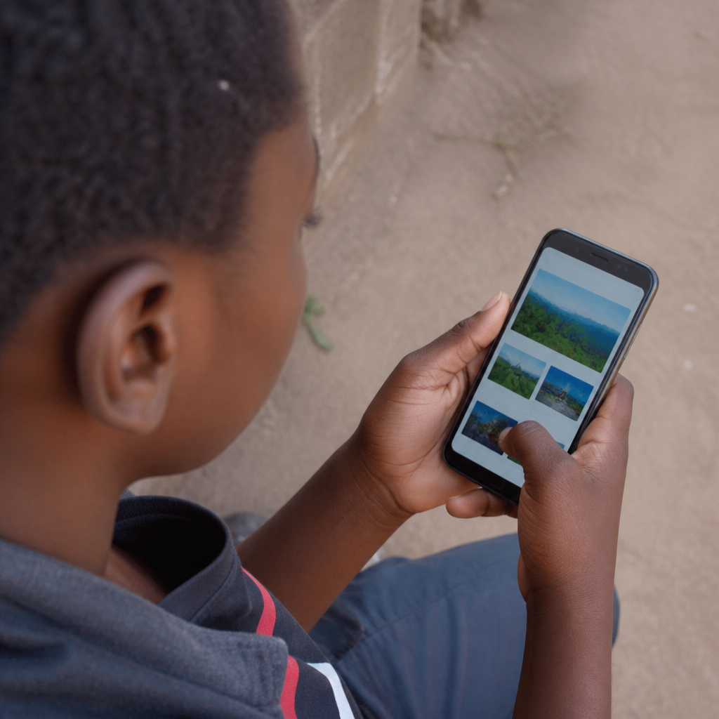 Close-up of a Zambian person using a mid-range Android smartphone to browse a fast-loading mobile website, outdoor setting with natural light suggesting limited connectivity, photorealistic, no text